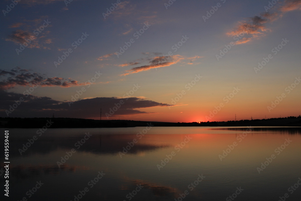 A sunset over a lake A sunset over a lake