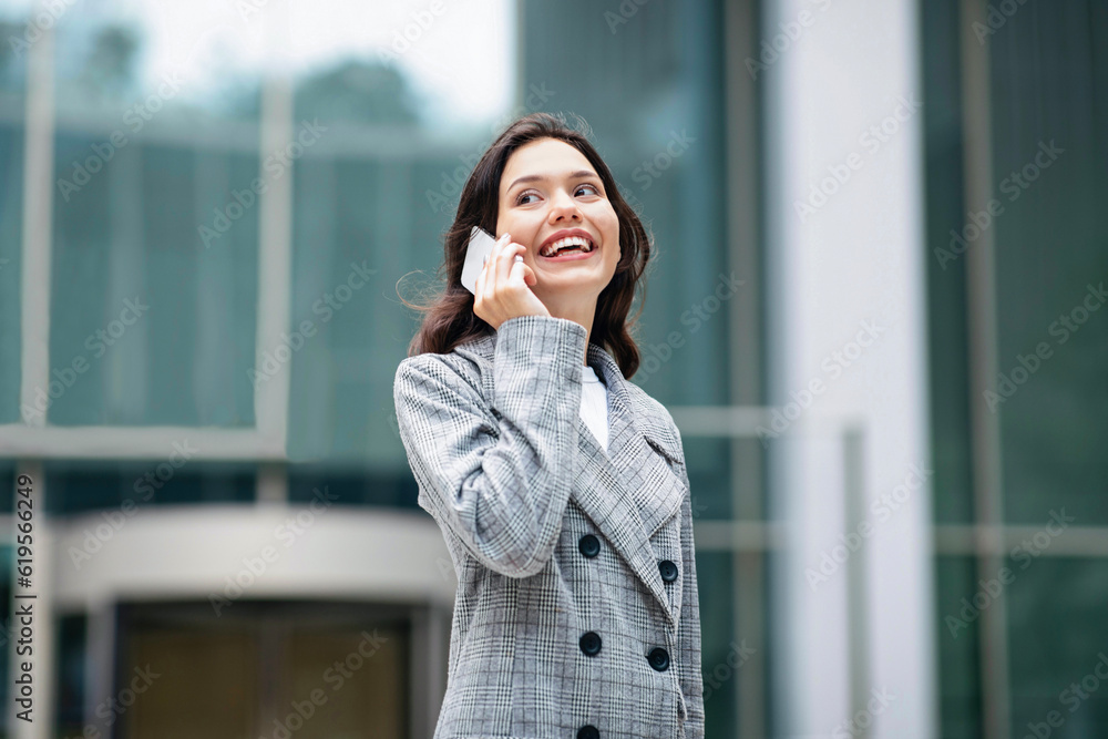 Young Business Woman Talking On Mobile Phone In Urban Area Young Business Woman Talking On Mobile Phone In Urban Area