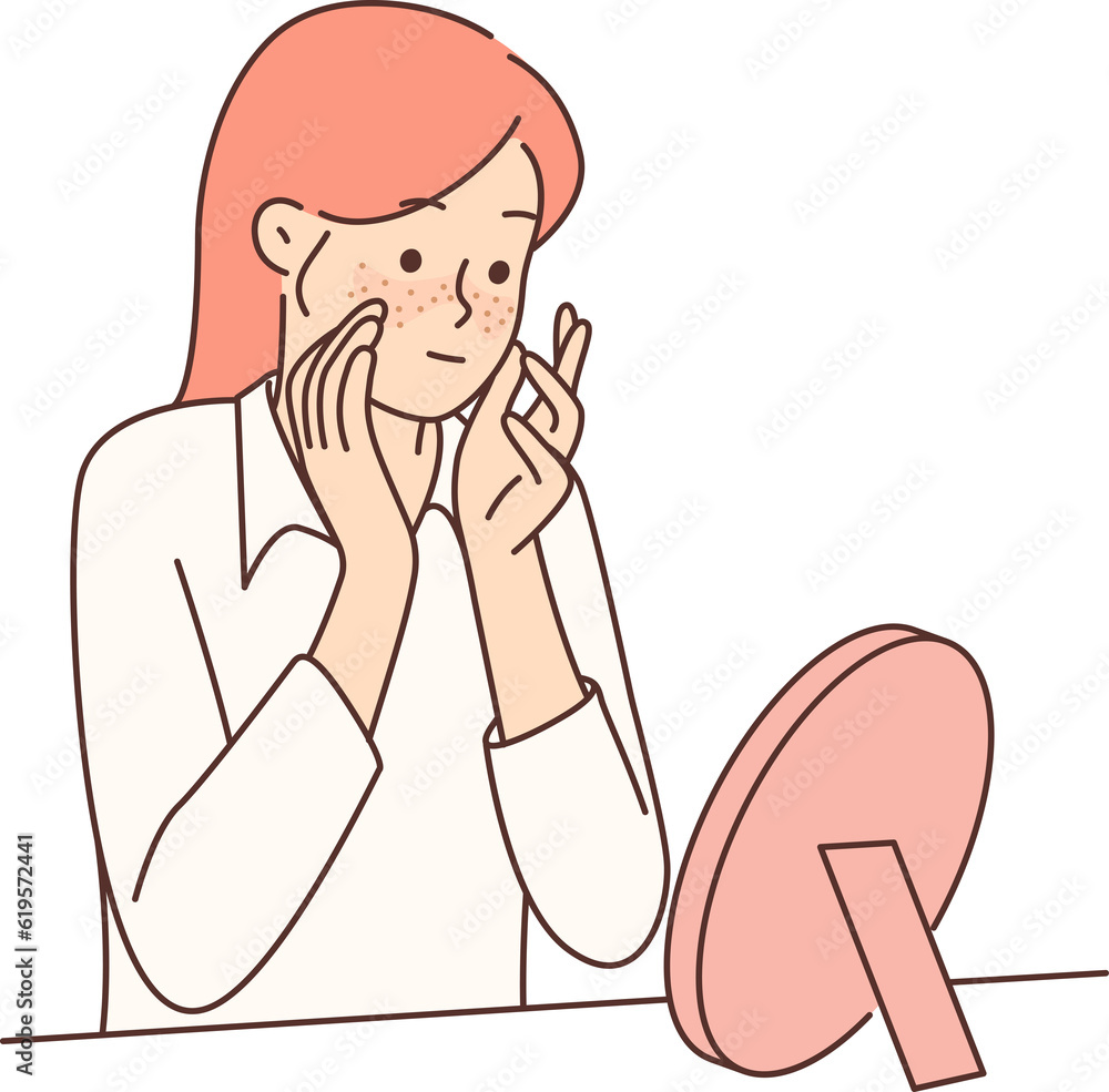 Teenager girl with freckles on face looks in mirror, studying rash or pimples that have appeared Teenager girl with freckles on face looks in mirror, studying rash or pimples that have appeared
