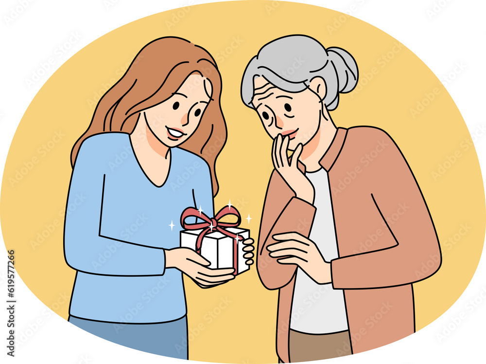 Caring young woman greeting elderly grandmother Caring young woman greeting elderly grandmother