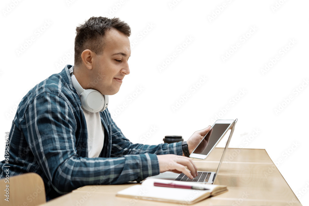 A student guy at school uses a laptop to study in class. Transparent background, png. A student guy at school uses a laptop to study in class. Transparent background, png.