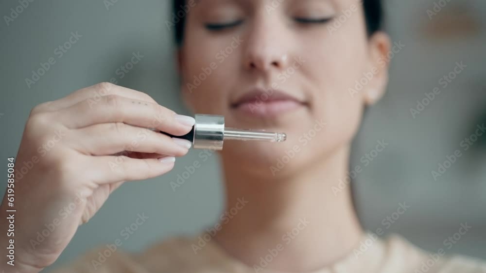 Video of cheerful woman holding a bottle of essential oil while testing it sitting on a couch at home. Video of cheerful woman holding a bottle of essential oil while testing it sitting on a couch at home.