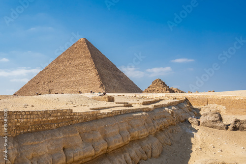 The Giza pyramid complex   Giza necropolis is home to the Great Pyramid  the Pyramid of Khafre  and the Great Sphinx in Cairo  Egypt.  Travel and history.