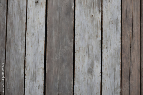 Old dark gray wood wall for wood background and texture. An old weathered wooden wall with a white paint striped pattern creates a rustic backdrop for your next design project. Generative AI