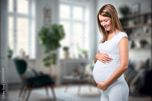 Portrait of young happy pregnant woman holding her belly, AI generated image Free Download Portrait of young happy pregnant woman holding her belly, AI generated image - GFXLoad