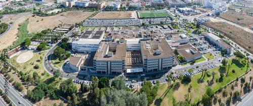 Aerial panoramic drone view of the Juan Ramon Jimenez University Hospital, a public hospital complex belonging to the Andalusian Health Service located in the Spanish city of Huelva photo
