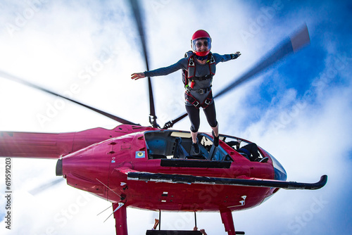 woman exits helicopter to skydive alone with a smile