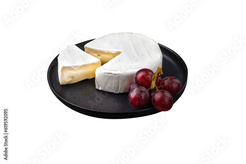 Camembert cheese on plate with fruits on transparent background