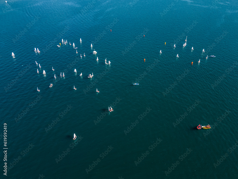 Aerial view of a sailing regatta on the lake. Orta San Giulia. Piedmont. Lake Orta. Italy. Aerial view of a sailing regatta on the lake. Orta San Giulia. Piedmont. Lake Orta. Italy.