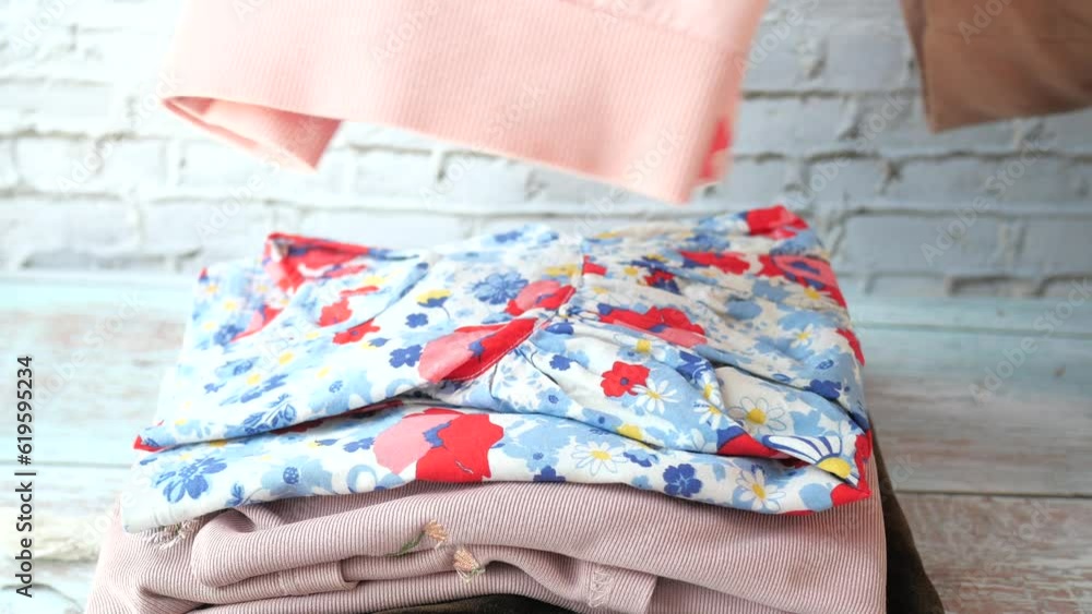 Stack of clothes on table indoor. Stack of clothes on table indoor.