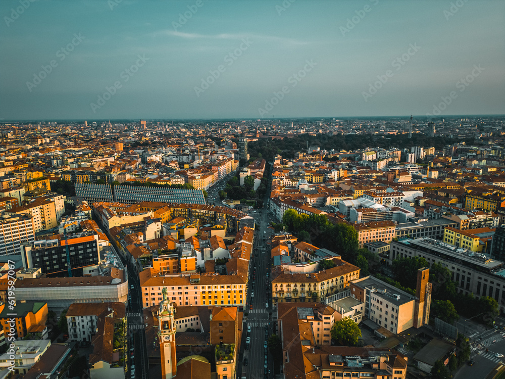 Fototapeta premium Drone photography of the city and the entrance to the monumental cemetery of Milan. Drone photography of Milan at sunset