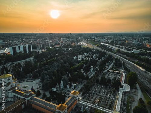 Drone photography of the city and the entrance to the monumental cemetery of Milan. Drone photography of Milan at sunset
