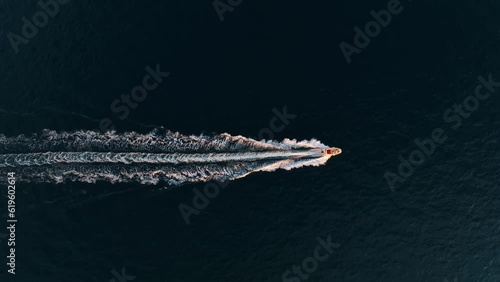 Vacation and leisure. Aerial view on fast boat on blue Mediterranean sea at sunny day. Fast ship on the sea surface. Seascape from the drone. Seascape from air. Seascape with motorboat.