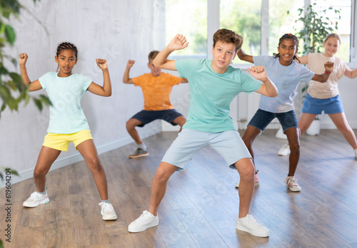 Dance studio - smiling girls and boys in dance lesson. High quality photo