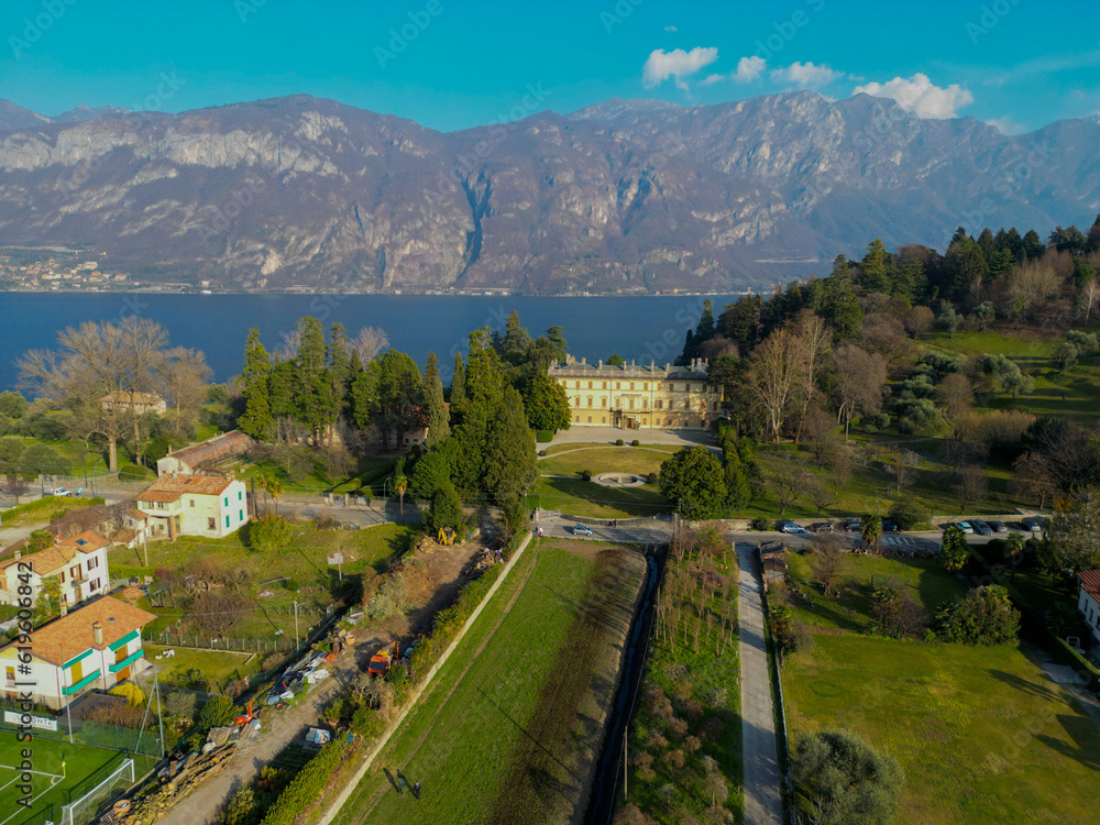 Aerial view of Bellagio in lake Como, a picturesque and traditional village in Lombardy, Italy. High top view to water landscape with green hills, mountains in summer. Drone lake Como.