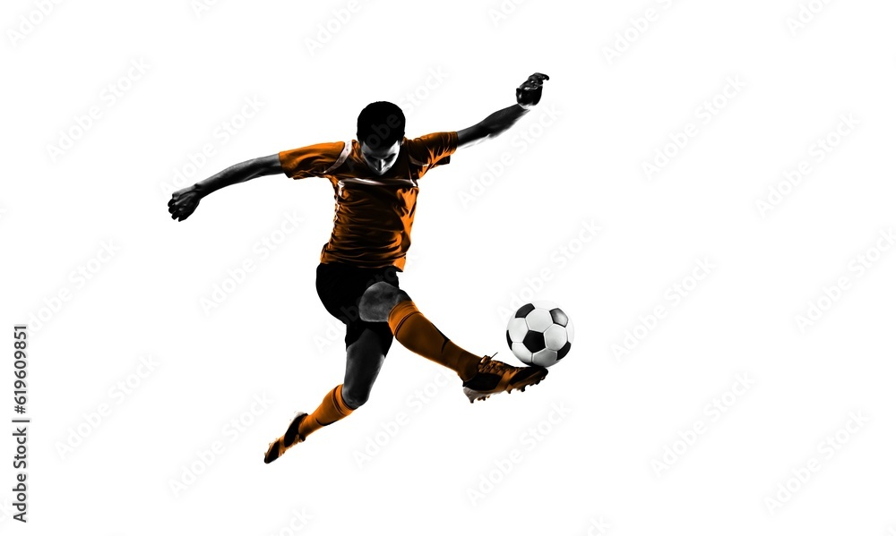 Young professional soccer player hitting ball