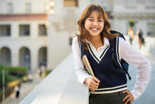 Friendly and warm Ivy League higher learning and intelligent student, lifestyle portrait with backpack and notebook on campus