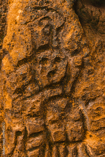 Canvas Print Rock texture hieroglyphs Taino art carved in the wall of the cave in Cueva del i