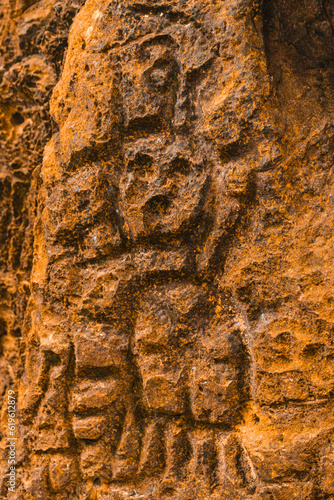 Canvas Print Rock texture hieroglyphs Taino art carved in the wall of the cave in Cueva del i