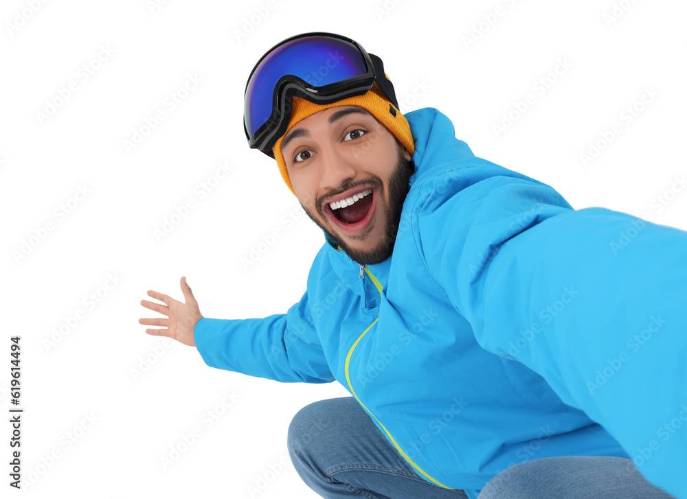 Smiling young man with ski goggles taking selfie on white background Smiling young man with ski goggles taking selfie on white background