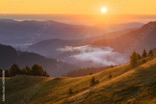 Ukraine, Ivano Frankivsk region, Verkhovyna district, Dzembronya village, Rolling landscape in Carpathian Mountains at sunset