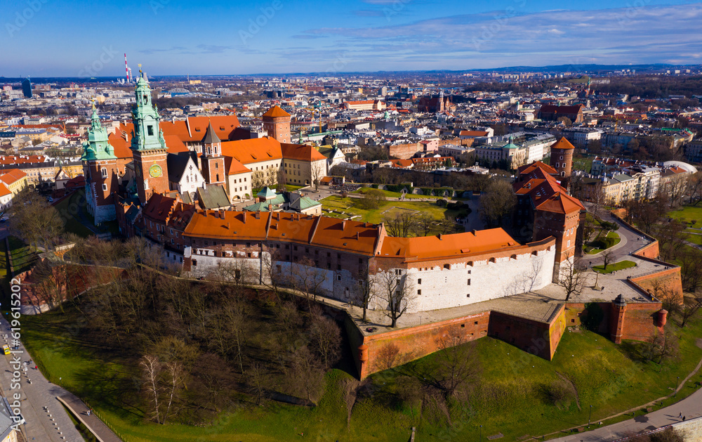 Aerial view of Wawel Hill with fortified Castle complex and belfry of Cathedral of Saints Stanislaus and Wenceslaus on sunny spring day, Krakow, Poland..