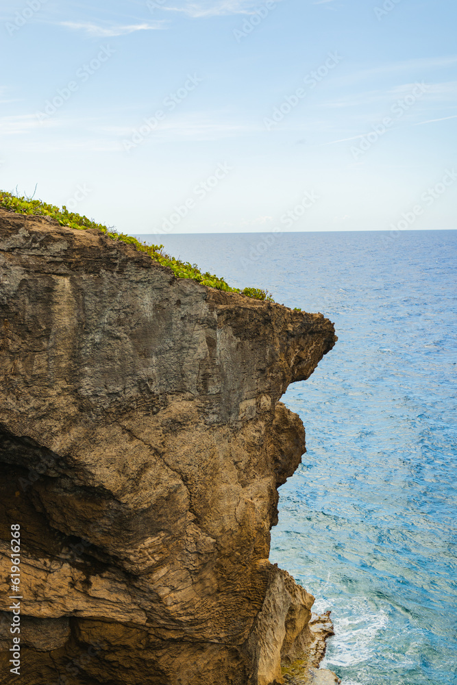 Cueva del indio rock cliff formation  landscape around turquoise water in a cloudy day from puerto rico in arecibo