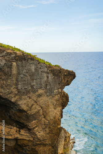 Cueva del indio rock cliff formation landscape around turquoise water in a cloudy day from puerto rico in arecibo