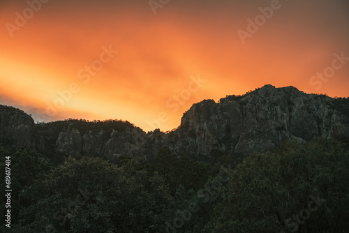 Orange Clouds Hang Over The Ridge In The Chisos Mountains of Big Bend