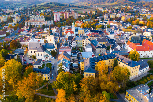Panoramic aerial view of autumn landscape of Czech town of Sumperk with Church of Saint John Baptist and Town hall at sunrise, Olomouc Region