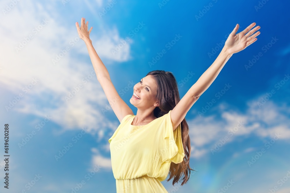 Beautiful young happy fit woman in front of blue sky Beautiful young happy fit woman in front of blue sky