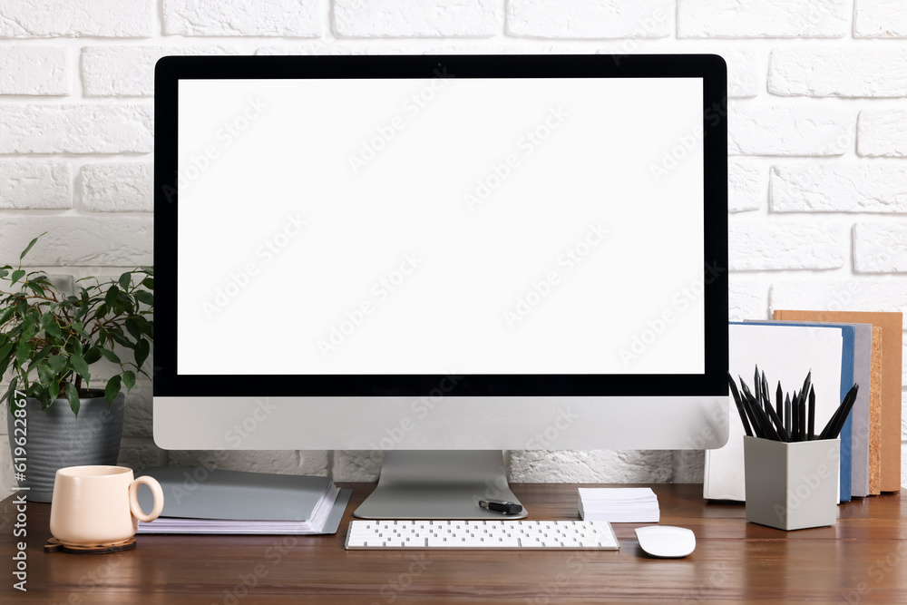 Fototapeta premium Cozy workspace with modern computer on wooden desk