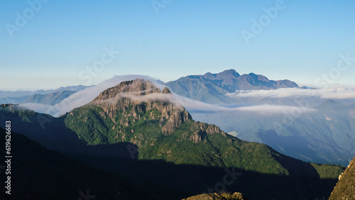 Itaguaré Peak being covered with clouds on sunrise. Passa Quatro, Minas Gerais, Brazil