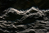 Dark Rock textured background. Surface stone texture. Solid concept. Abstract natural pattern for design.