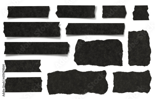 Fotografia set / collection of black ripped textured paper strips, scraps and tape isolated