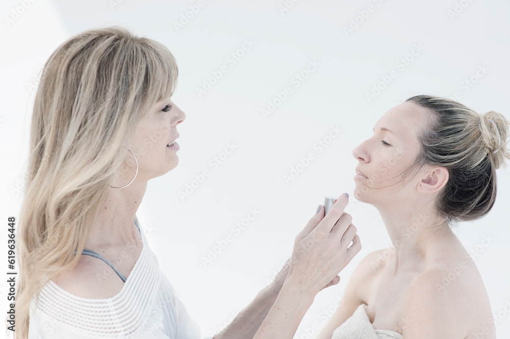 Photograph of a beautiful middle aged woman taken for a day spa photographed on white. Photograph of a beautiful middle aged woman taken for a day spa photographed on white.