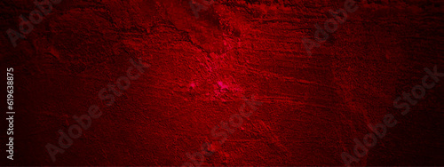 Dark red splattered grungy backdrop. Grunge texture of a dilapidated wall in a red tone