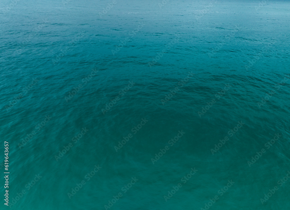 Obraz premium Sea surface aerial view,Bird eye view photo of blue waves and water surface texture, Blue sea background, Beautiful nature Amazing view sea background