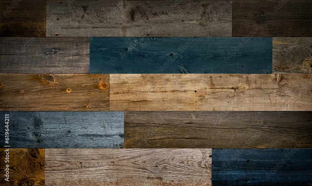 Dark stained reclaimed wood surface with aged boards lined up. Wooden
