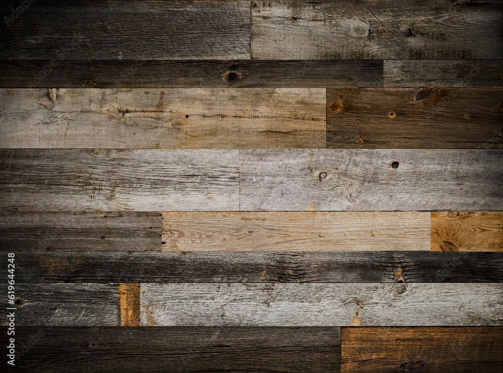 Dark stained reclaimed wood surface with aged boards lined up. Wooden