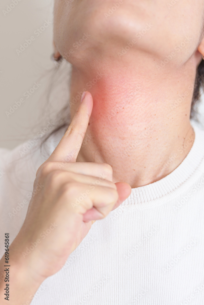 Woman checking Thyroid gland disease. Hand holding Neck pain. Hyperthyroidism, Hypothyroidism, Hashimoto Thyroiditis, Thyroid Tumor and Cancer, Postpartum, Papillary Carcinoma and Health concept Woman checking Thyroid gland disease. Hand holding Neck pain. Hyperthyroidism, Hypothyroidism, Hashimoto Thyroiditis, Thyroid Tumor and Cancer, Postpartum, Papillary Carcinoma and Health concept