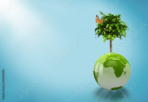 Tree growing on globe Earth on background
