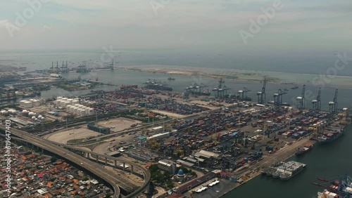 Aerial view of sea cargo port with containers and cranes. Tanjung Priok port. Indonesia. photo