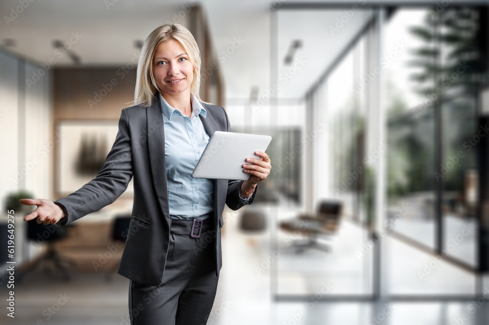 Young businesswoman hold digital tablet in the office, AI generated image Young businesswoman hold digital tablet in the office, AI generated image