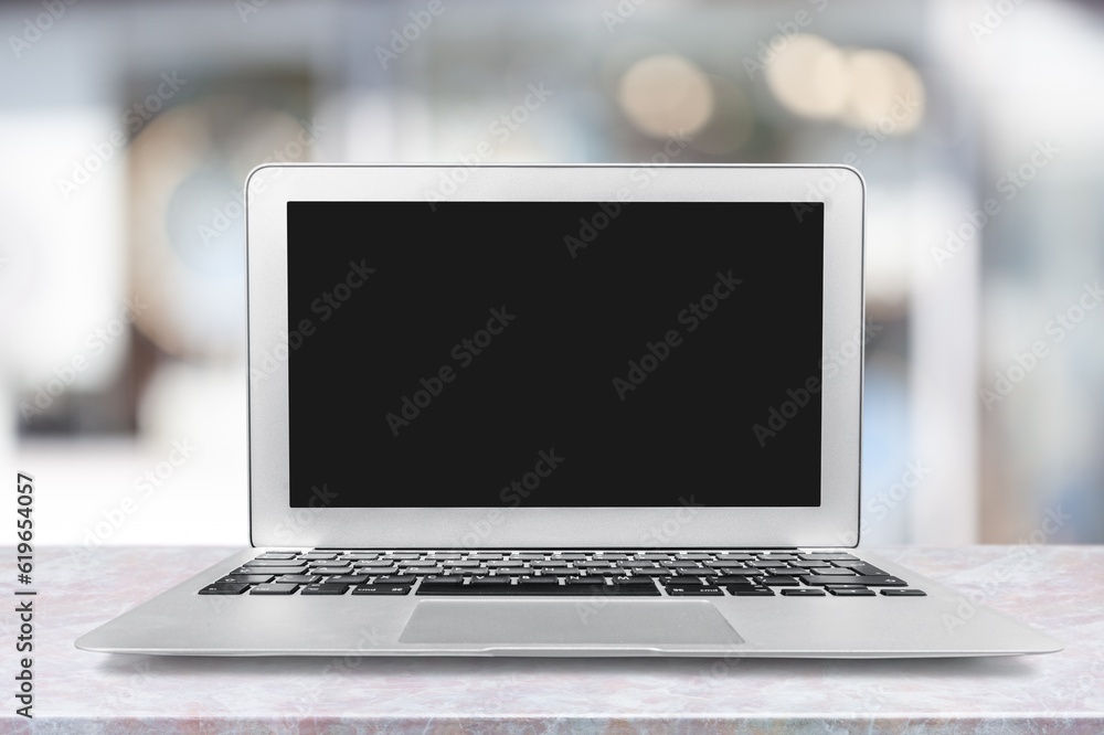 Laptop computer with a blank screen on the desk Laptop computer with a blank screen on the desk