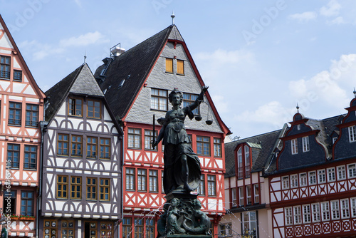 Old town square romerberg in Frankfurt, Germany. Frankfurt altstadt. Old town square romerberg with Justitia statue in Frankfurt Germany photo