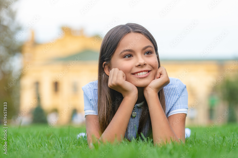 smiling girl relax at summer lawn outdoor. photo of girl relax at summer lawn. smiling girl relax at summer lawn outdoor. photo of girl relax at summer lawn.