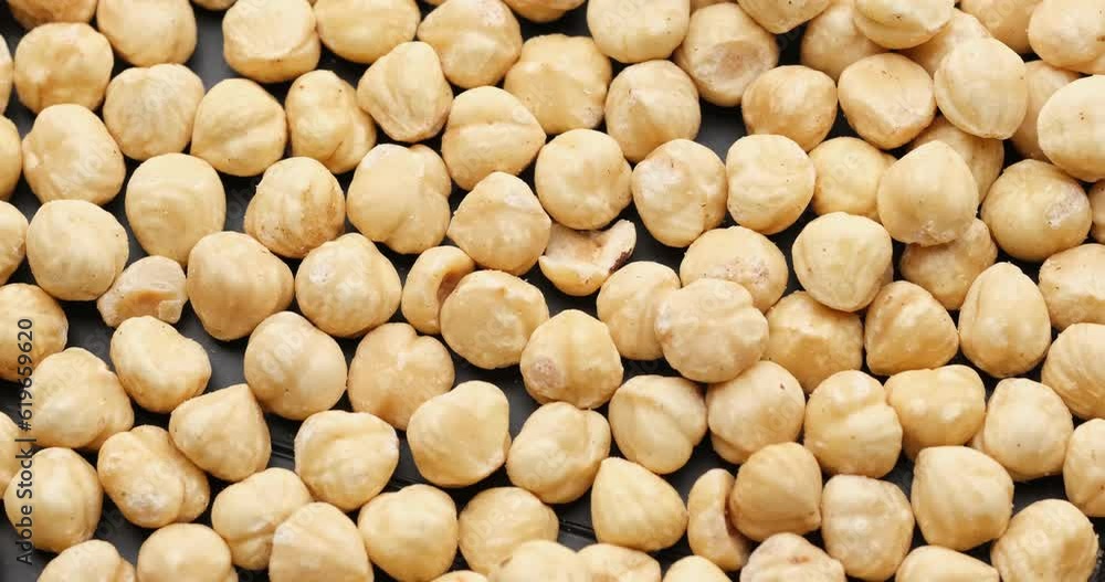 Whole shelled hazelnuts nuts kernels close-up on rotating platform Whole shelled hazelnuts nuts kernels close-up on rotating platform