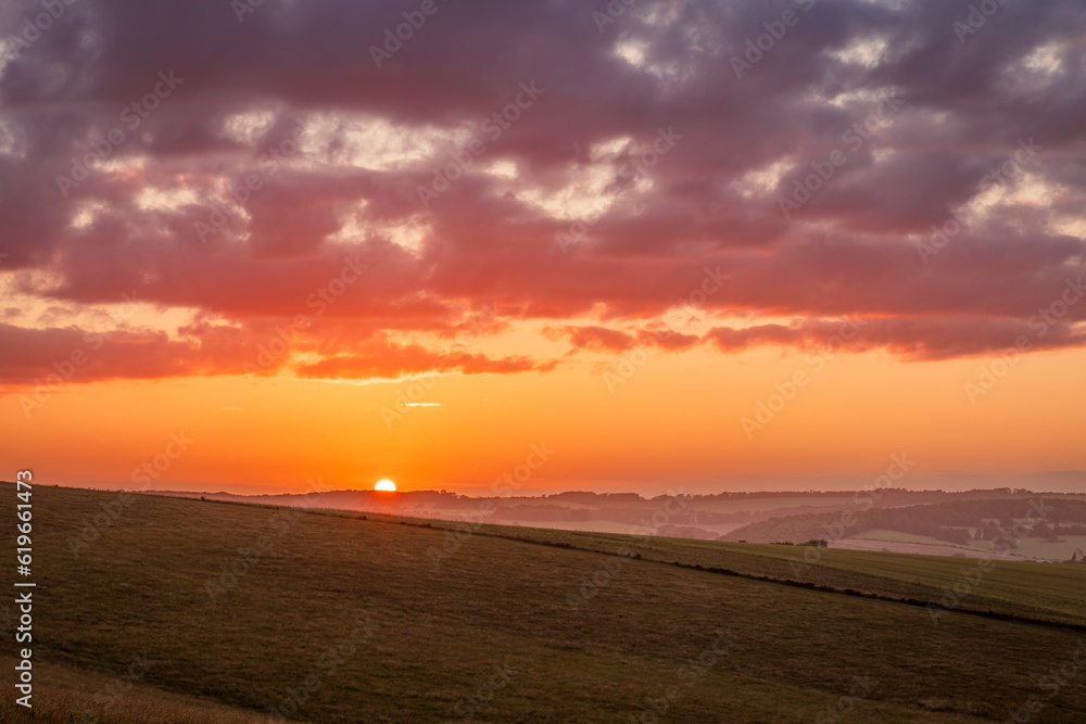 July sunset over the south downs from Falmer Road Brighton East Sussex south east England UK