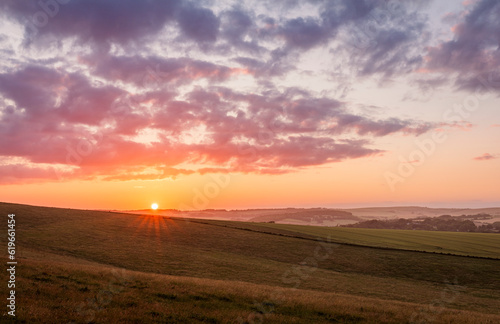 July sunset over the south downs from Falmer Road Brighton East Sussex south east England UK